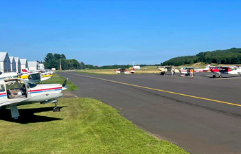 Small airplanes parked on the tarmac at the municipal airport at the Village of Boyceville, Wisconsin.